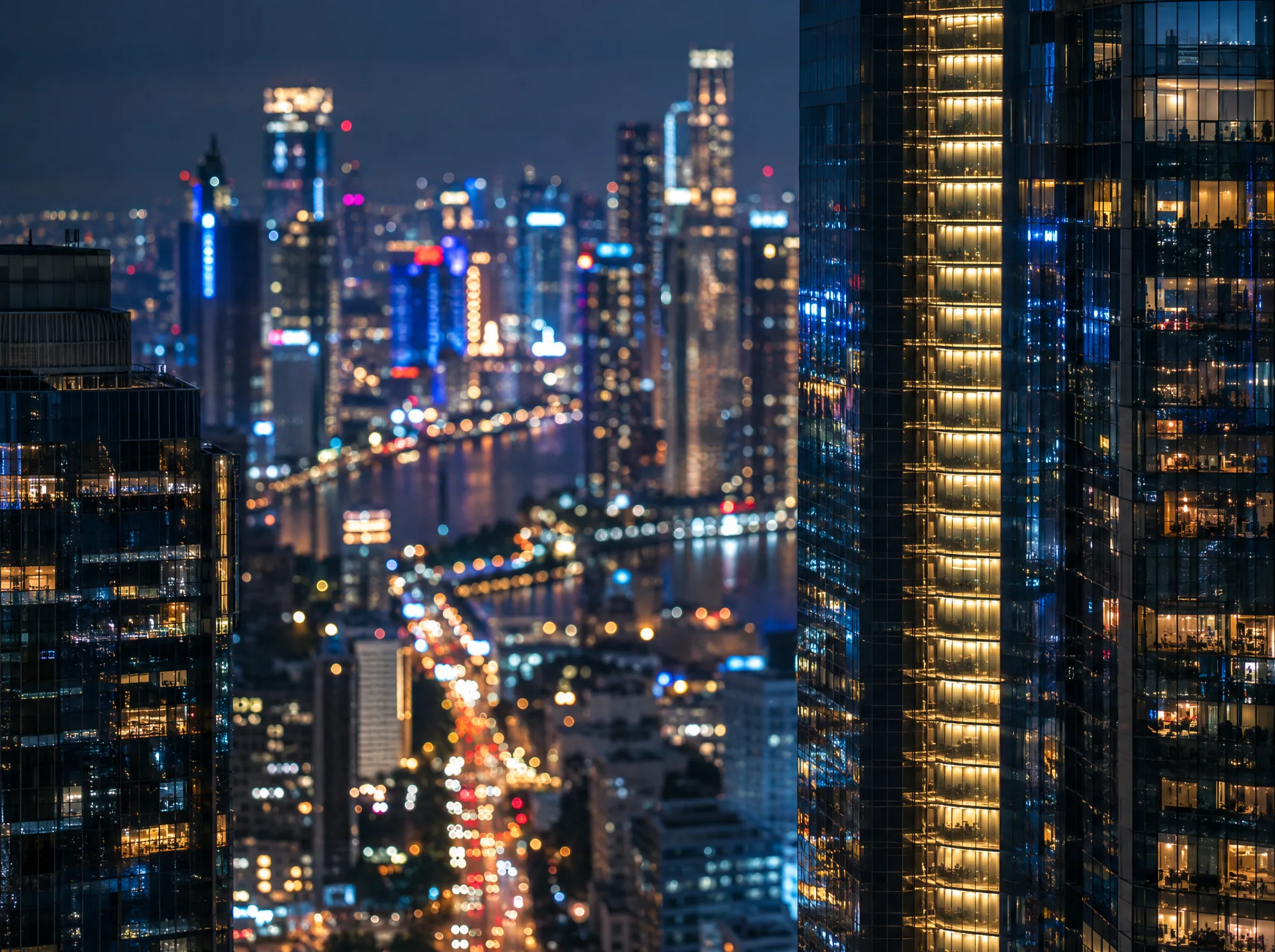 A dense city skyline glowing at night